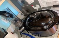 Photo showing Rival Crock-Pot slow cooker with glass lid and KitchenAid blender base with pitcher.