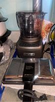Image showing the Cuisinart food processor in metallic brown with transparent bowl and Totstino sandwich maker in foreground