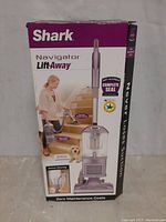 Front view of the Shark Navigator Lift-Away vacuum cleaner box showing product image and branding.