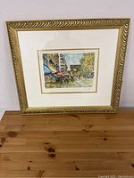 Full view of framed watercolor artwork showing Paris street scene with Arc de Triomphe in background.