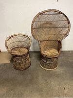Two rattan peacock style chairs of different sizes side by side showing full front view and scale.