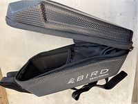 Side view of the closed hard shell exterior showing carbon fiber texture and brand name BIRD, Hi Pro Muskoka.