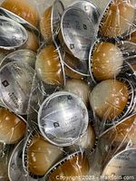 Plastic sealed bundle of multiple Nespresso Vertuo Bianco Leggero coffee pods with a beige dome and printed foil tops.