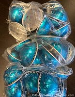 30 Nespresso Vertuo pods in blue capsules sealed in clear plastic bags.