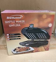 Box of Brentwood waffle maker highlighting 750 watts power, non-stick surface, and ability to cook 2 waffles in minutes.