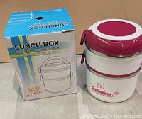 Lunch box with its original blue and white retail box showing brand and design.