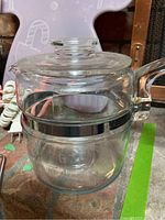 Clear glass Pyrex 6-cup coffee pot without filter on surface