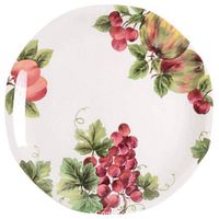 Close-up of a dinner plate featuring a vintage grape cluster design with leaves on a white background.