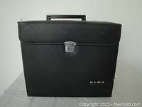 Closed black carrying case with Elmo branding on front, used for transporting the projector