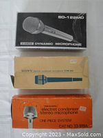Three boxed microphones: Ando SD-122MD, Sony ECM-250, and Realistic 33-919A