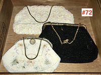 Three vintage beaded evening bags arranged together showing different colors and styles.