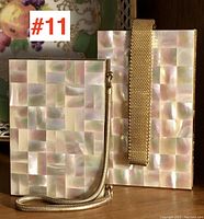 Two vintage 1940s ladies make-up or evening bags with mother-of-pearl mosaic tile exterior and metal handles, photographed side by side showing their front faces.