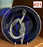 Top view showing the full Art Deco silver overlay design on the cobalt blue plate.