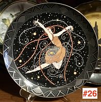 Full view of the Royal Doulton Art Deco style porcelain plate featuring a dancer in motion on a black background with geometric border.