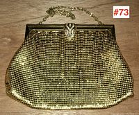 Front view of gold mesh evening bag showing full shape, surface texture, and frame with clasp and chain visible.