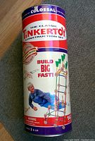 Photo of original cylindrical container for Tinkertoy set with branding and size information