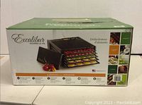 Original packaging box for Excalibur 5-tray food dehydrator showing product image and features.