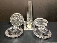 Photo showing full set of Waterford and Royal Copenhagen crystal decor items including bud vase, rose bowl, ash receiver, desk clock and votive holders.