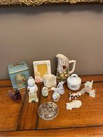 Full view of all figurines, vases, miniatures, and decorative tin showing variety and assortment in the collection