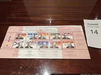 Full view of the sheet of 12 stamps featuring premiers of Canadian provinces, each with the premier's portrait, province name, and flag symbol.
