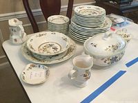 Full view of Mikasa Heritage dishes arranged on table with Wedgwood pitcher and Nippon dish visible