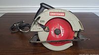 Side view of Craftsman circular saw showing blade size and model number 233.