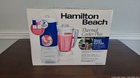 Photo of Hamilton Beach Thermal Cooler Plus blender and cooler box showing product image and branding