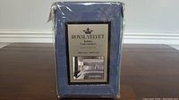 Package of Royal Velvet Queen size bedskirt with product label showing product details.