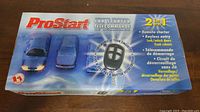 Box of ProStart remote control car starter with label showing 2-in-1 functions: remote starter and keyless entry (lock/unlock doors, trunk release).