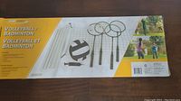 Box showing the volleyball and badminton set contents including net, rackets, volleyball, and pump.