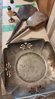 Vanity set brush and mirror with salt and pepper shakers on shelf
