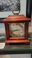 Full view of Bulova wooden mantel clock showing overall design and size