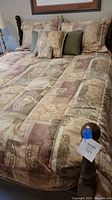 Full view of queen comforter set with all included pillows on bed