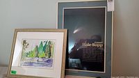 Front view showing framed watercolor landscape and Comet Hale-Bopp poster