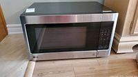 Front view of LG microwave showing stainless steel door and control panel