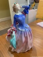 Front view of the Royal Doulton figurine showing the color and dress details