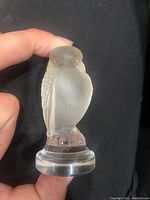 Front view of the small glass bird figurine showing frosted glass finish and detailed feather etching.