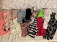 Full view of all tops laid out showing variety of colors, styles, and patterns.