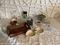 Wide view of all kitchen items including wooden tray, bowls, plates, box, and card holder.