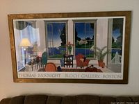 Front view of large Thomas McKnight print framed on wall showing interior scene with furniture and window