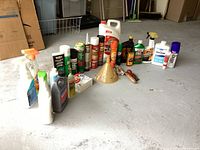 Overview of all various used cleaning and maintenance supplies arranged on floor