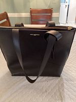 Front view of black Karl Lagerfeld handbag showing clean design and logo