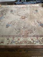 Full view of rug laid flat showing overall design, color, and condition.