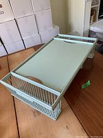Full view of the bed tray showing main tray surface and slatted sides.