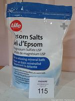 Front view of unopened 2kg Life brand Epsom salts bag showing brand name, product type, usage benefits and instructions.