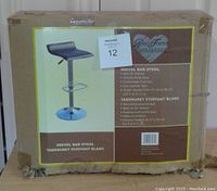 Box front showing product image and key features including gas lift, chrome base, faux leather seat, adjustable height 22.5 to 31.5 inches.