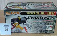 Photo of the product box showing the electric winch brand, model, and key features.