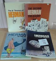 Photo of four softcover books from the Treasury of Herman series by Jim Unger, Titles 1 to 4 visible.