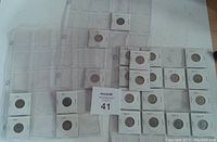 Multiple United States five cent coins in individual 2x2 holders arranged in plastic pages for coin storage. Coins dated between 1946 and 1969 with mint marks including Denver (D) and San Francisco (S).
