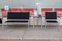 Photo showing the two-seater bench, single chair, and side table together, highlighting the set arrangement and condition.